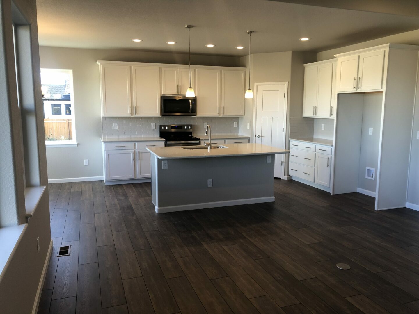 White theme Kitchen storage with wooden flooring