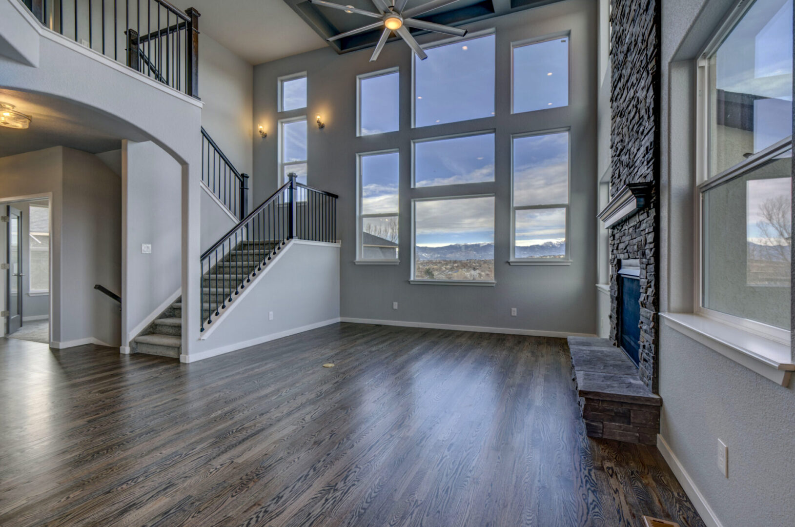 Living area with wall mounted Fire pit and wooden flooring