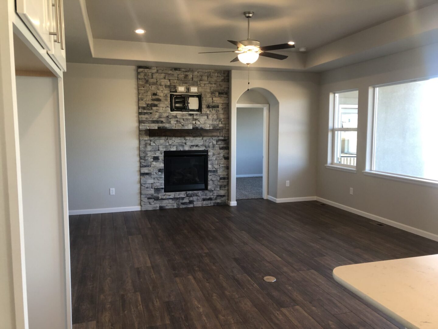 Living room with the fire pit area and wooden flooring