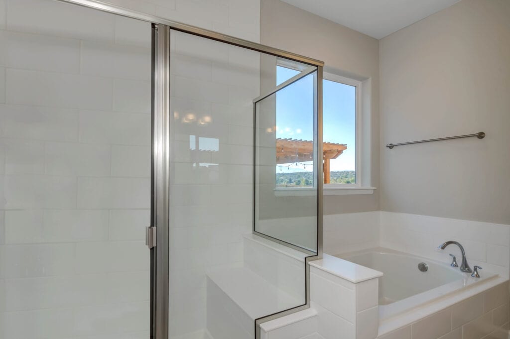 A Beautiful White Theme Bathroom With Separate Shower Area